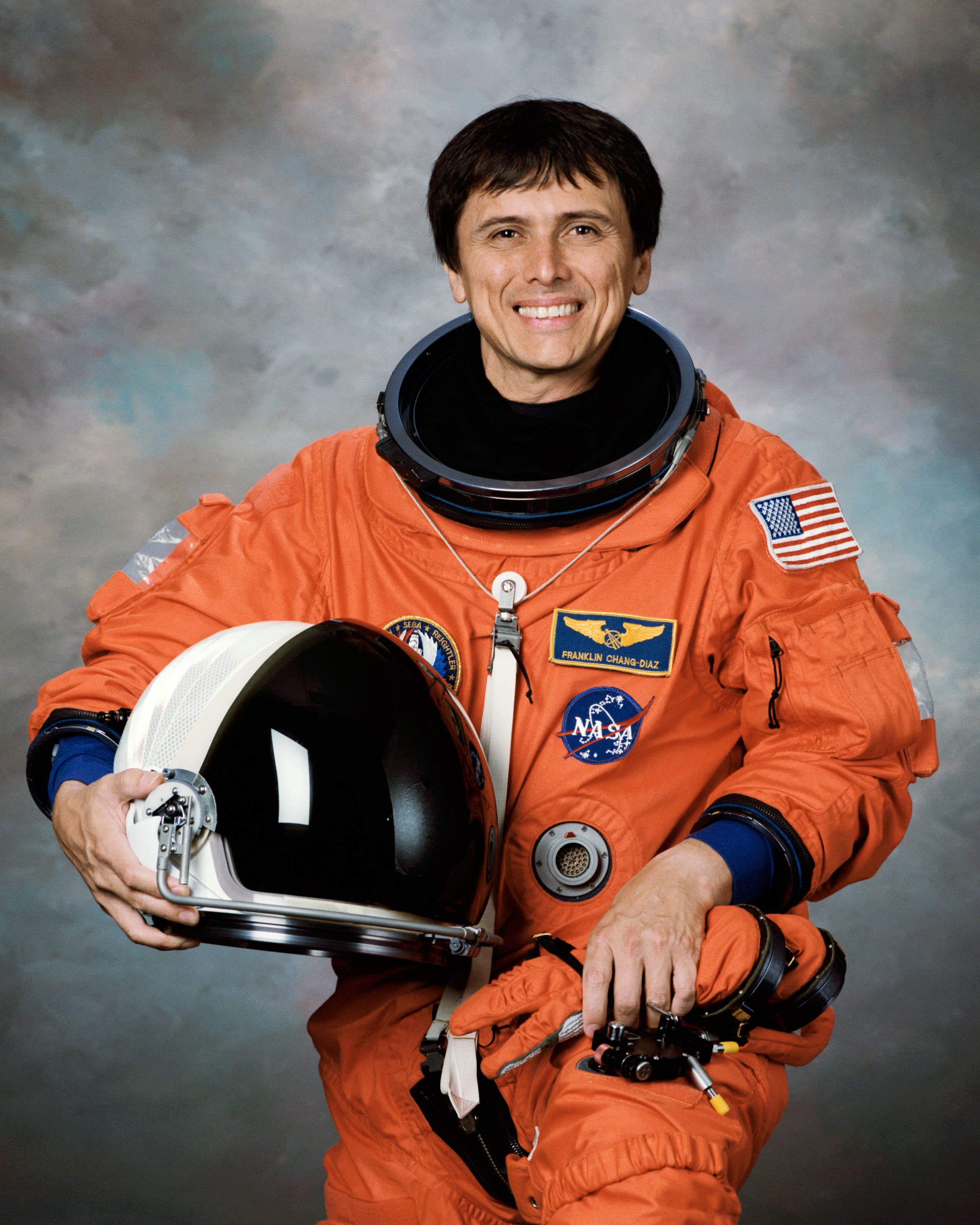 Official NASA portrait of astronaut Franklin Chang-Díaz in a blue flight suit.